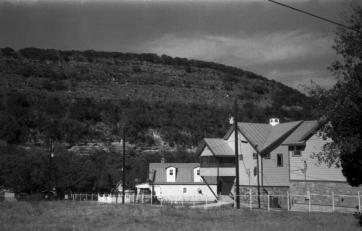 some rental condos in front of a big ass hill 